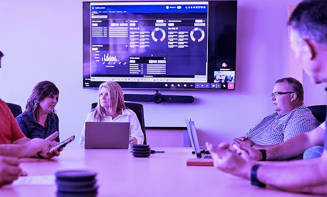 Business meeting with presentation and team collaboration